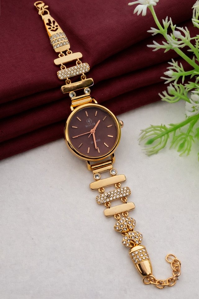 Elegant gold-toned wristwatch with crystal bracelet
